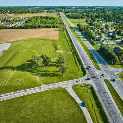 h-road-intersection-aerial-with-distant-houses-trees-field_501731-8158